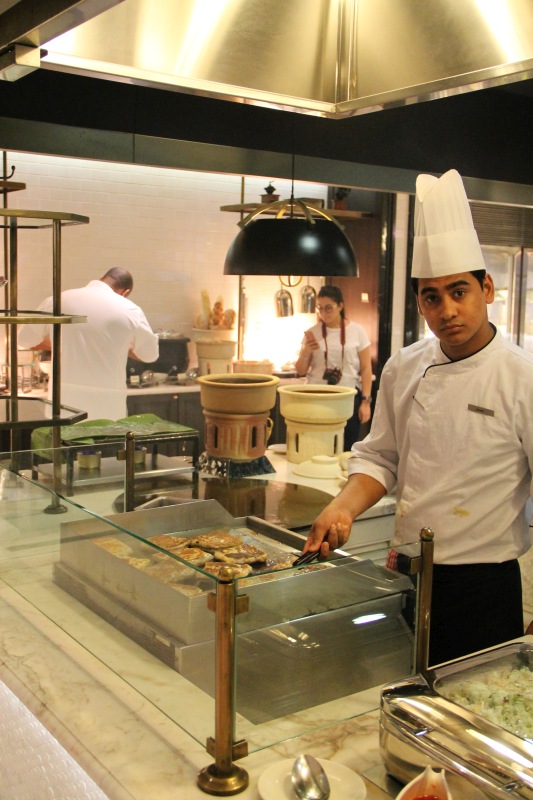 The chef busy flipping tasty murtabaks on the hot grill