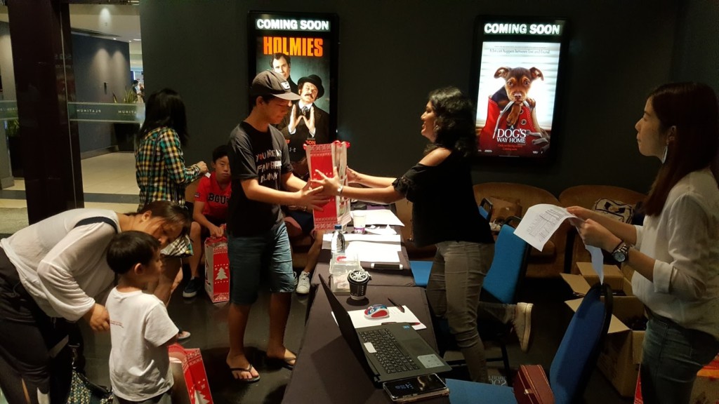 Guests purchasing gifts by way of donation for the gift exchange session.