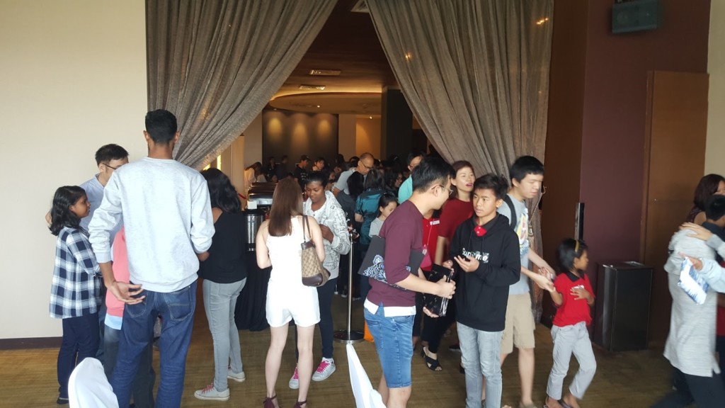 The adults and children excitedly trying to finish their tasks during games time. 